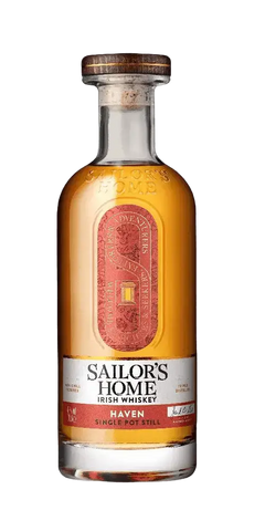 Irischer Whiskey Sailor's Home HAVEN in einer klaren Flasche mit goldener Flüssigkeit und rotem Etikett.