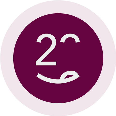 Icon mit einem lächelnden Gesicht und der Zahl 23 auf lila Hintergrund, symbolisiert Freude und Kreativität.