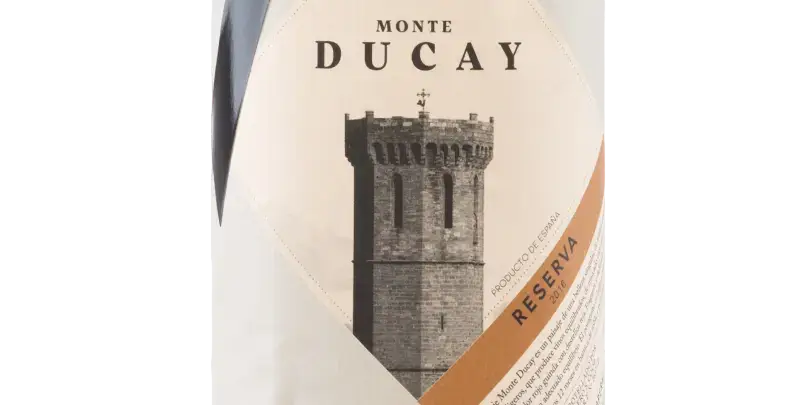 Monte Ducay Reserva: Weinetikett mit historischem Turm aus der Weinregion Cariñena, symbolisiert Tradition und Qualität.