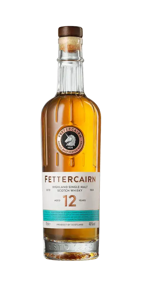 Schottischer Whisky Fettercairn 12 Jahre, Single Malt aus den Highlands, in klarer Flasche mit bernsteinhoniger Farbe.